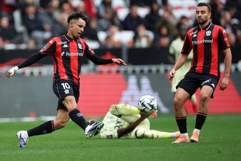 Monaco's Senegalese midfielder #15 Lamine Camara (C) fights for the ball with Nice's Moroccan forward #10 Sofiane Diop (L) during the French L1 football match between OGC Nice and AS Monaco at the Allianz Riviera Stadium in Nice, south-eastern France, on February 8, 2026.   Valery HACHE / AFP