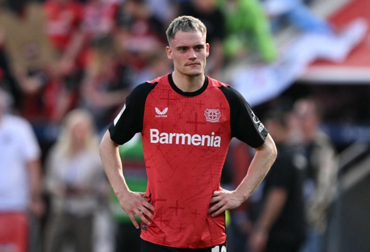 Bayer Leverkusen's German midfielder #10 Florian Wirtz reacts after the German first division Bundesliga football match between Bayer Leverkusen and Union Berlin in Leverkusen, western Germany, on April 12, 2025.  INA FASSBENDER / AFP