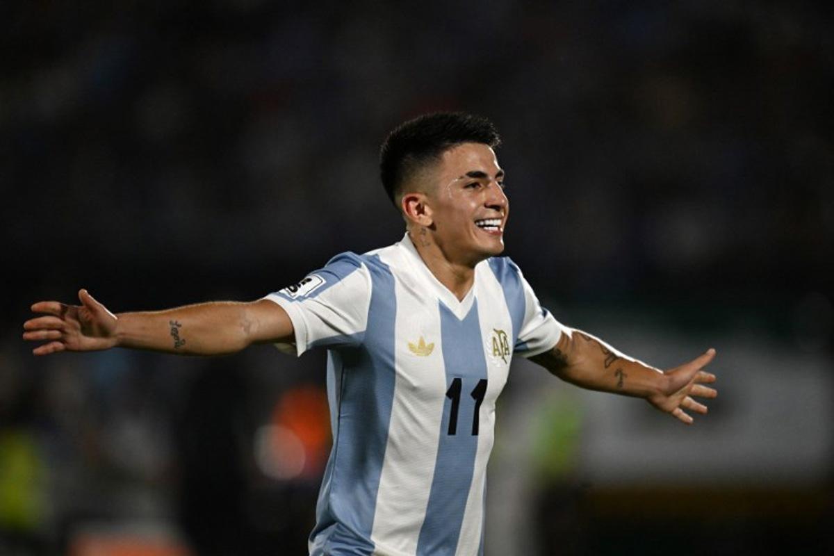 Argentina's midfielder #11 Thiago Almada celebrates after scoring during the 2026 FIFA World Cup South American qualifiers football match between Uruguay and Argentina at the Centenario stadium in Montevideo, on March 21, 2025.  Eitan ABRAMOVICH / AFP