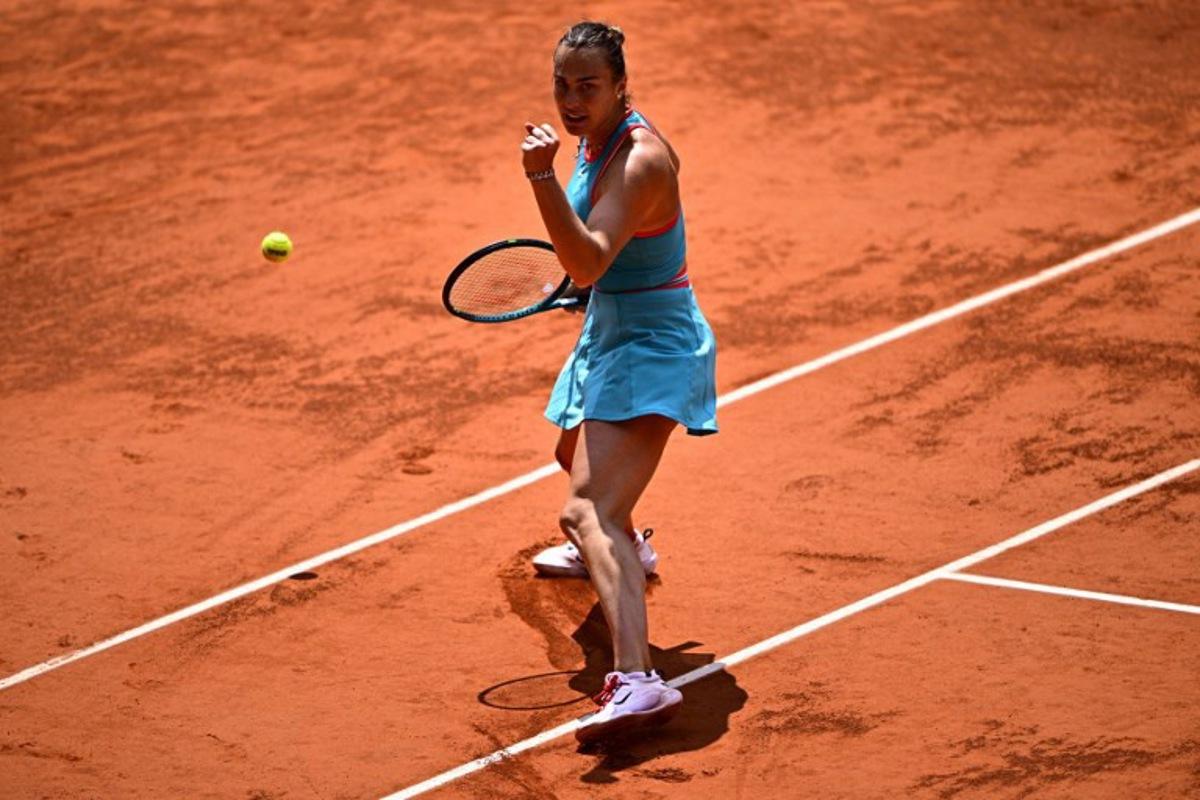 Belarus' Aryna Sabalenka celebrates after winning against China's Zheng Qinwen during their quarter-final women's singles match on day 10 of the French Open tennis tournament on Court Philippe-Chatrier at the Roland-Garros Complex in Paris on June 3, 2025.  JULIEN DE ROSA / AFP