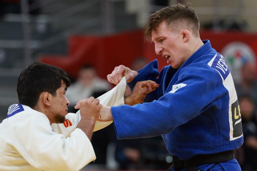 Uzbekistan's Samariddin Kuchkarov (white) competes against Belgium's Jorre Verstraeten in the men's under 60 kg bronze medal bout at the Tbilisi Grand Slam judo tournament in Tbilisi on March 20, 2026. Giorgi ARJEVANIDZE / AFP