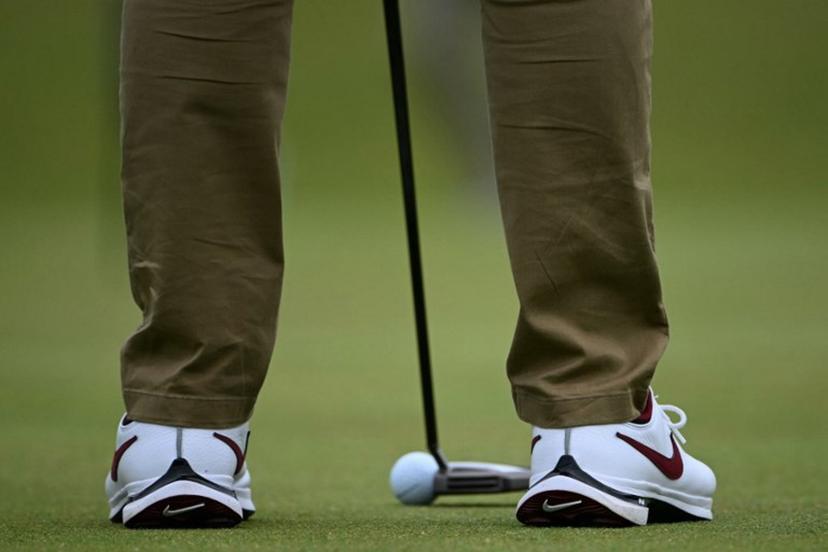 Northern Ireland's Rory McIlroy putts on the 12th green during a practice round ahead of the 152nd British Open Golf Championship at Royal Troon on the south west coast of Scotland on July 17, 2024.  ANDY BUCHANAN / AFP