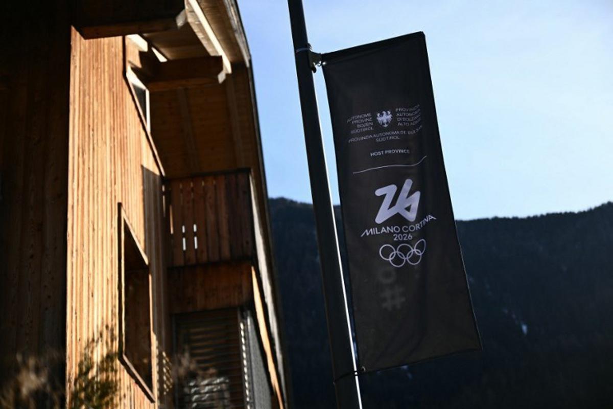 A banner with the logo of Milano Cortina 2026 Olympic Games is pictured in Anterselva / Antholz where the Biathlon Arena will host the competition, on January 24, 2025.   Marco BERTORELLO / AFP