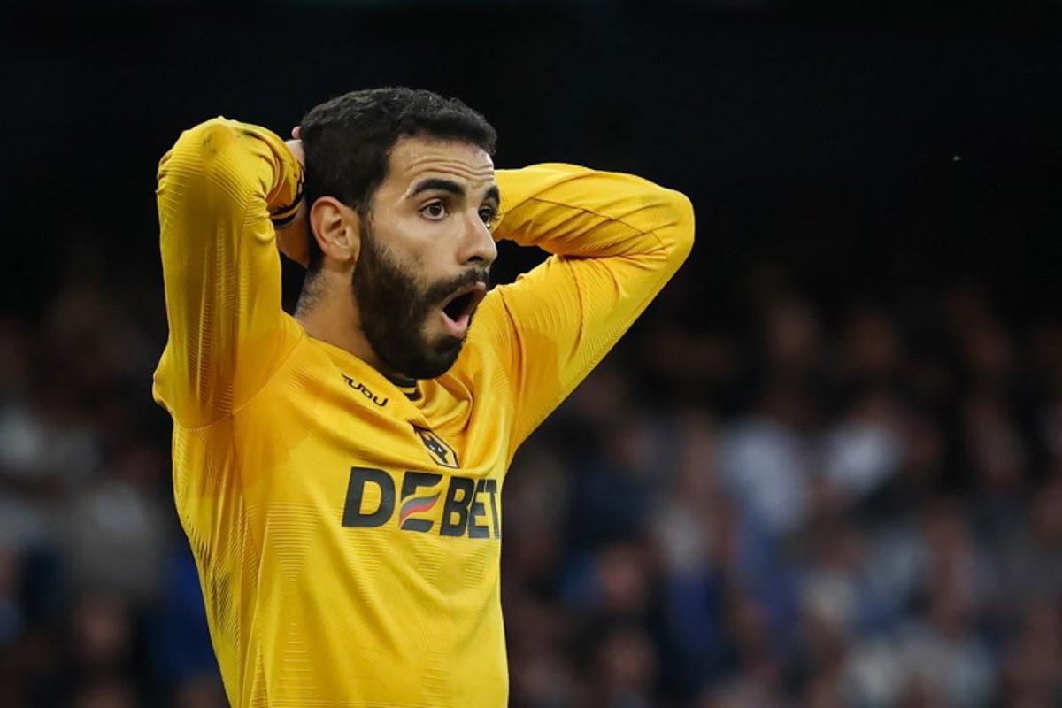 Wolverhampton Wanderers' French defender #03 Rayan Ait-Nouri reacts after a missed chance during the English Premier League football match between Manchester City and Wolverhampton Wanderers at the Etihad Stadium in Manchester, north west England, on May 2, 2025.  Darren Staples / AFP