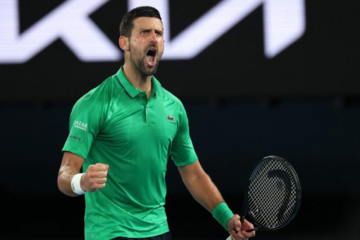Serbia's Novak Djokovic reacts on a point to Italy's Jannik Sinner during their men's singles semi-final match on day thirteen of the Australian Open tennis tournament in Melbourne on January 31, 2026.  DAVID GRAY / AFP