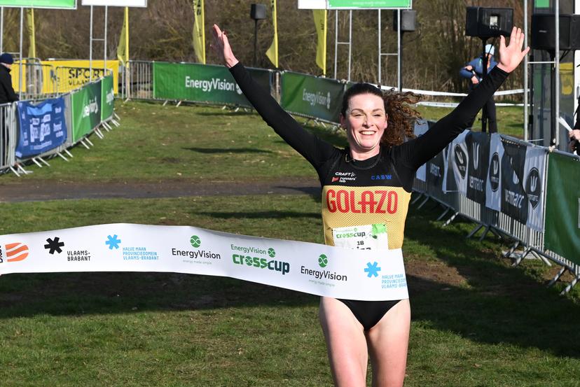 Belgian Lisa Rooms celebrates as she crosses the finish line at the women's race at the CrossCup cross country running athletics event in Diest, the fourth stage of the CrossCup competition, on Sunday 15 February 2026. BELGA PHOTO JILL DELSAUX