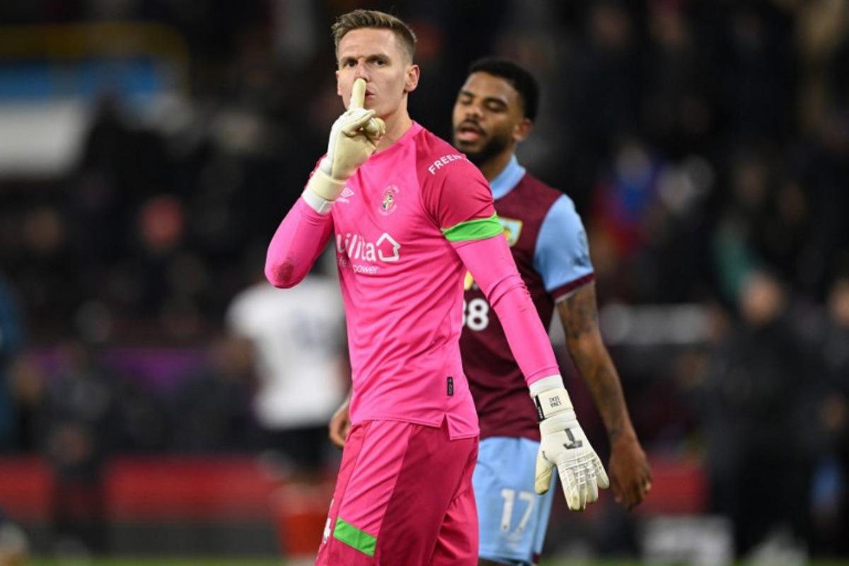 Luton Town's Belgian goalkeeper #24 Thomas Kaminski reacts on the final whistle in the English Premier League football match between Burnley and Luton Town at Turf Moor in Burnley, north-west England on January 12, 2024. The game finished 1-1. Oli SCARFF / AFP