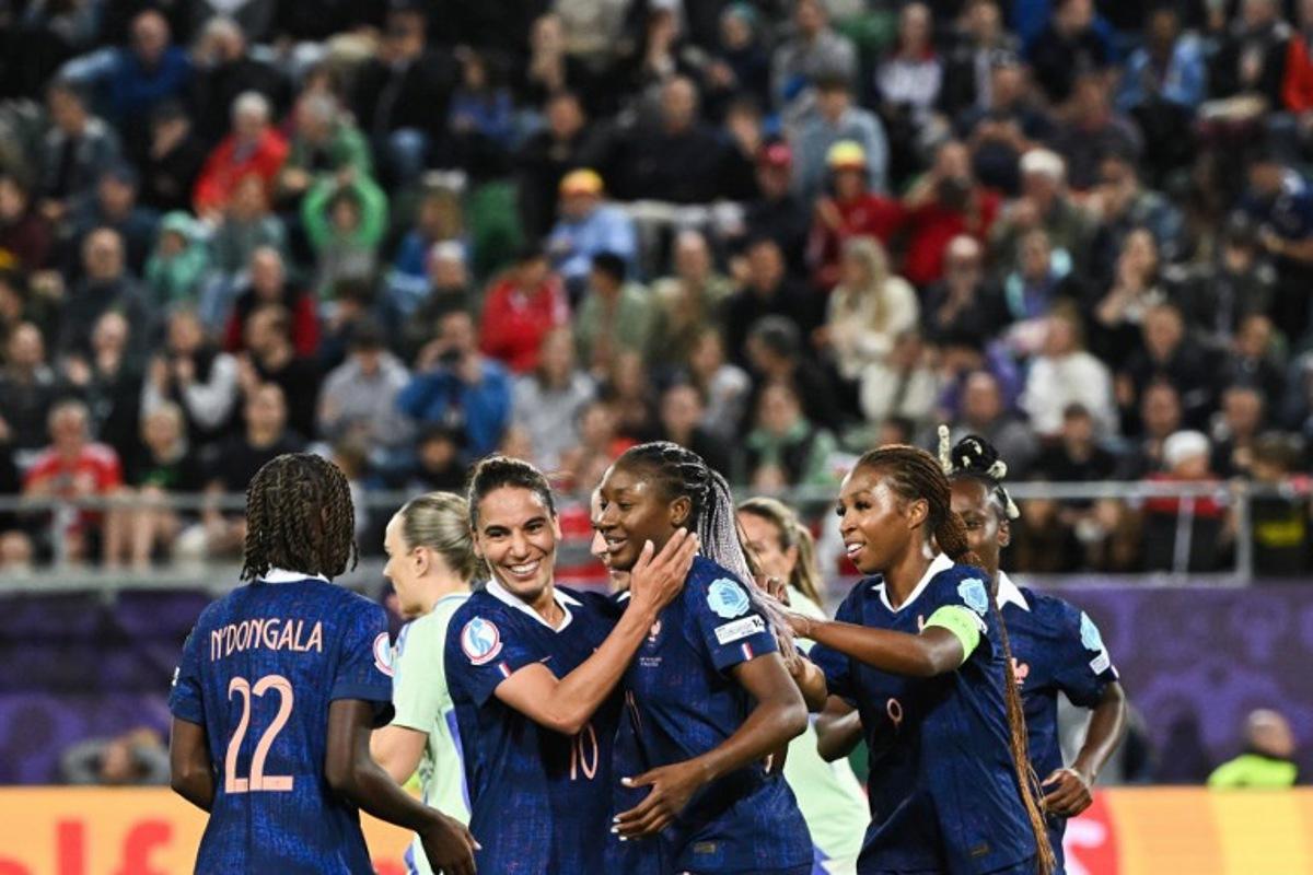 France's forward #11 Kadidiatou Diani celebrate with teammates after scoring a penalty goal during the UEFA Women's Euro 2025 Group D football match between France and Wales at the Arena St.Gallen in St. Gallen on July 9, 2025.  SEBASTIEN BOZON / AFP