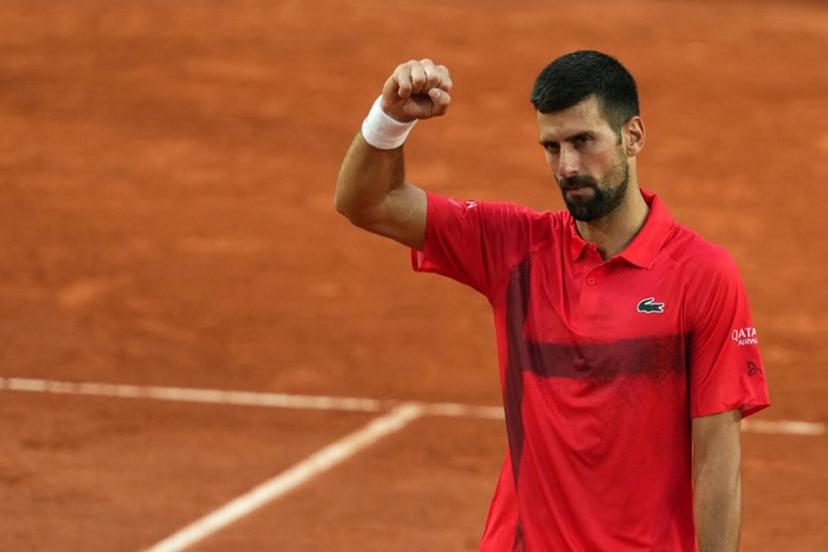 Serbia's Novak Djokovic celebrates his victory over France's Corentin Moutet during their men's singles match on day 5 of the French Open tennis tournament on Court Suzanne-Lenglen at the Roland-Garros Complex in Paris on May 29, 2025.  Dimitar DILKOFF / AFP