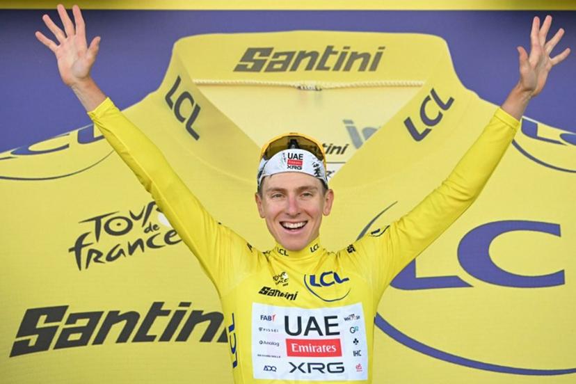 UAE Team Emirates - XRG team's Slovenian rider Tadej Pogacar celebrates on the podium with the overall leader's yellow jersey after the 5th stage of the 112th edition of the Tour de France cycling race, 33 km individual time trial starting and finishing in Caen, northwestern France, on July 9, 2025.  Loic VENANCE / AFP