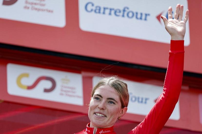 Team SD Worx - Protime's Dutch rider Demi Vollering celebrates her overall victory on the podium after winning the 8th stage of the 2024 La Vuelta Femenina cycling tour of Spain, an 89,5 km race from Madrid to Valdesqui ski resort, in Rascafria, on May 5, 2024.  OSCAR DEL POZO / AFP