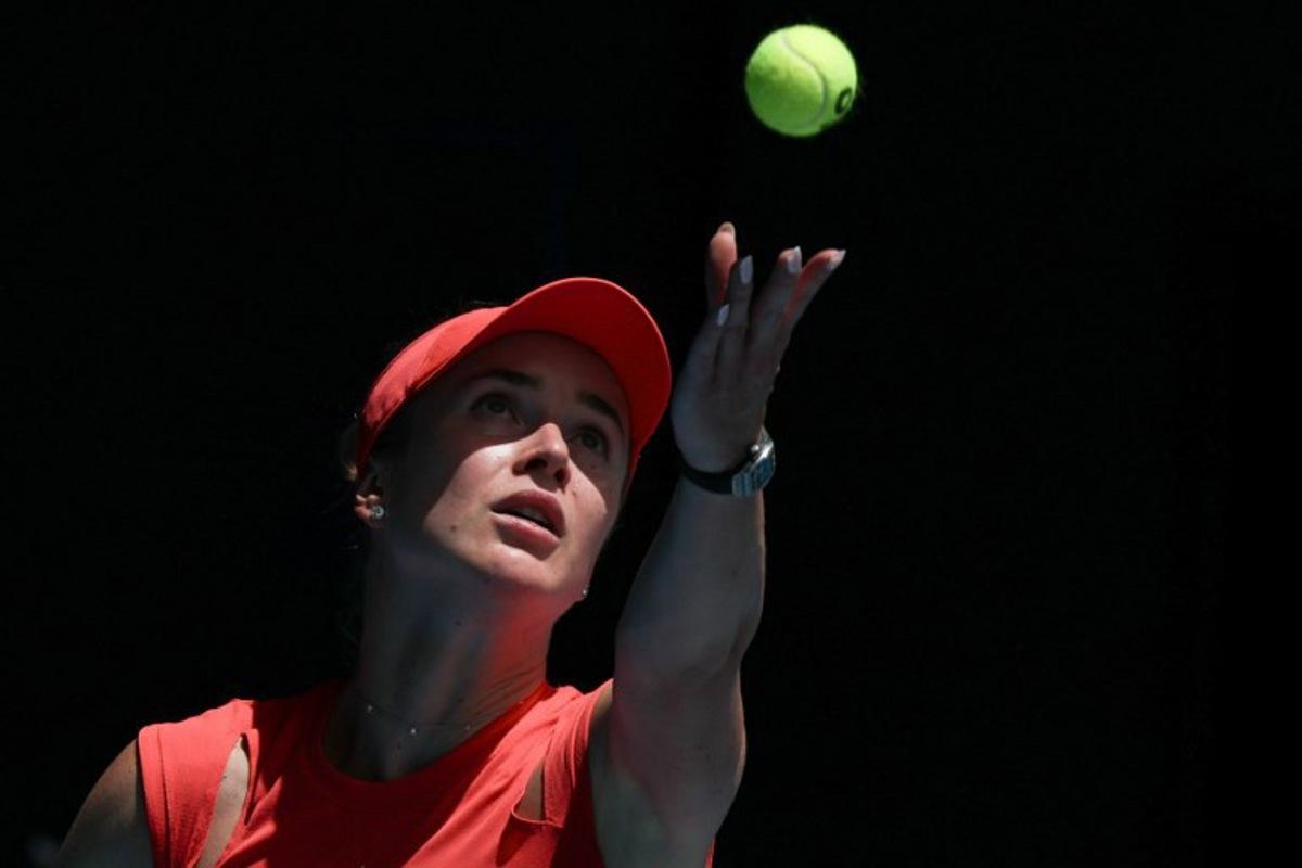 Ukraine's Elina Svitolina serves against USA's Madison Keys during their women's singles quarter-final match on day eleven of the Australian Open tennis tournament in Melbourne on January 22, 2025.  Adrian DENNIS / AFP