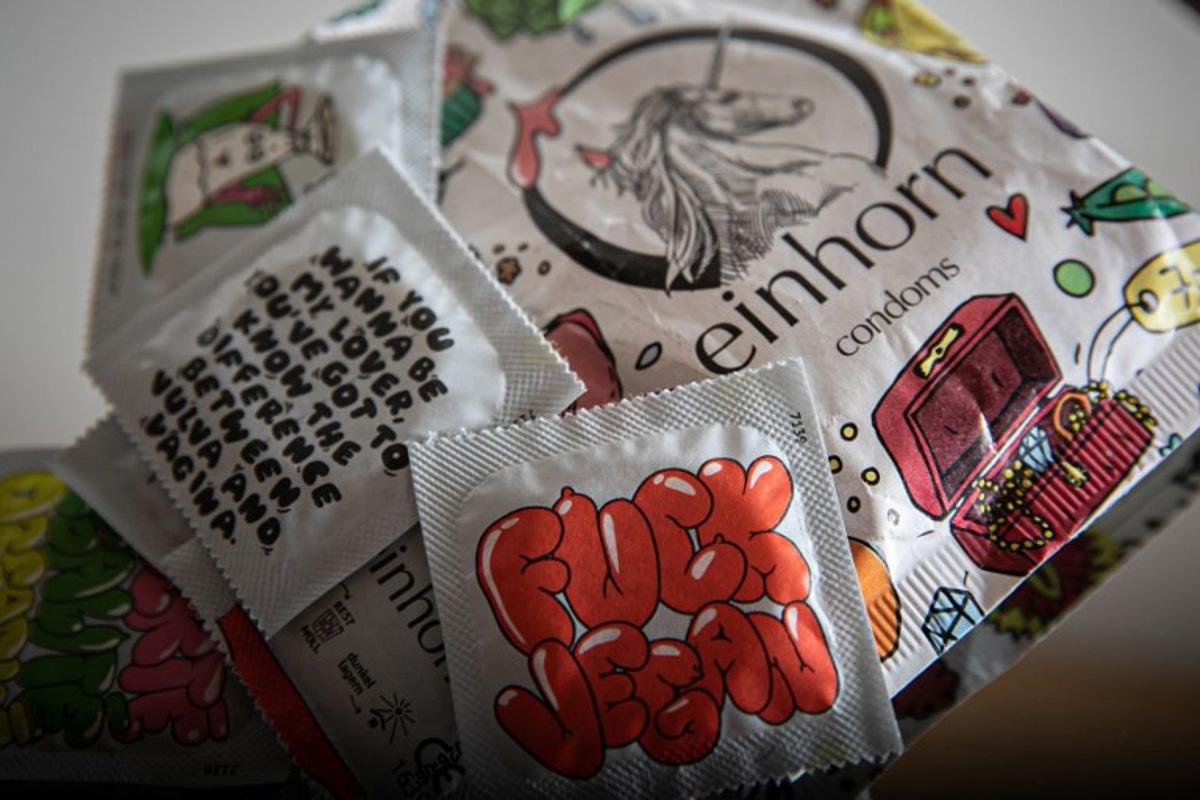 This photograph taken on April 25, 2023, in Courseulles-sur-Mer, shows packets of condoms.   Lou BENOIST / AFP
