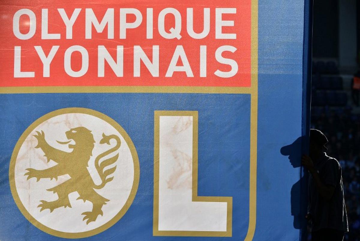 (FILES) The flag with the logo of Olympique Lyonnais is seen during the French Ligue 1 football match between Toulouse FC (TFC) and Olympique Lyonnais (OL) on October 29, 2016, at the Municipal Stadium in Toulouse southern France. Olympique Lyonnais have been relegated to Ligue 2 by the French National Control and Management Committee (DNCG), the French Professional Football League LFP announced on June 24, 2025. Rémy GABALDA / AFP