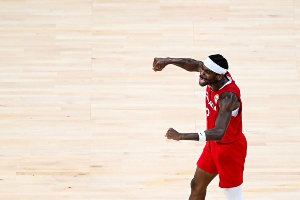 Canada's Shai Gilgeous-Alexander celebrates victory at the end of the FIBA Basketball World Cup game for third place between Canada and USA in Manila on September 10, 2023.  SHERWIN VARDELEON / AFP
