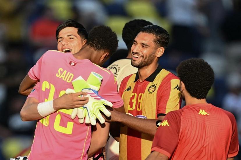 Esperance's Tunisian goalkeeper #32 Bechir Ben Said (C) celebrates with teammates Tunisian goalkeeper #01 Amenallah Memmiche and Tunisian midfielder #38 Khalil Guenichi after winning the FIFA Club World Cup 2025 Group D football match between US Los Angeles FC and Tunis' Esperance Sportive de Tunis at the Geodis Park stadium in Nashville on June 20, 2025.  Paul ELLIS / AFP