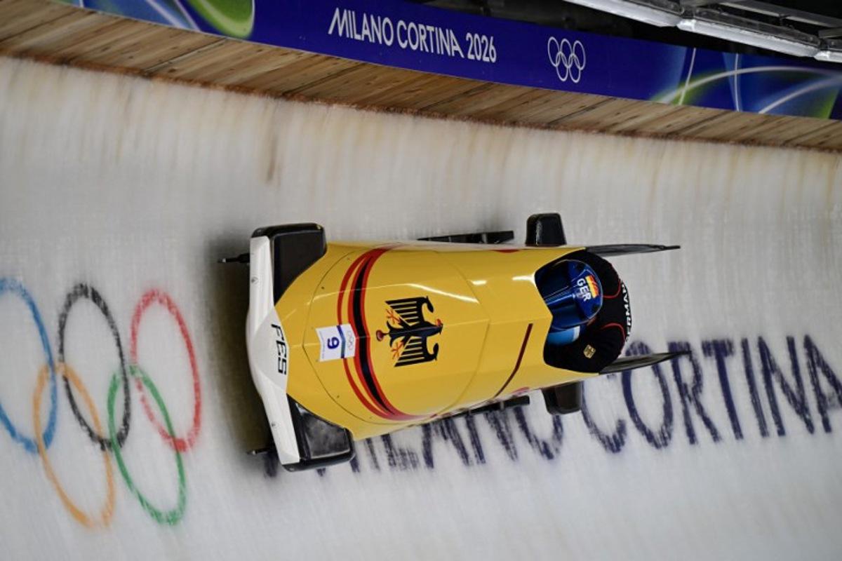 Germany's Johannes Lochner pilots in the bobsleigh men's 2-man training Heat 4 at Cortina Sliding Centre during the Milano Cortina 2026 Winter Olympic Games in Cortina d'Ampezzo on February 13, 2026.  Stefano RELLANDINI / AFP