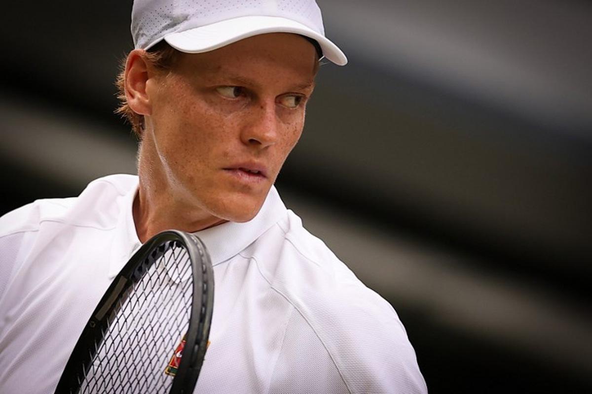 Italy's Jannik Sinner reacts as he plays against US player Ben Shelton during their men's singles quarter-final tennis match on the tenth day of the 2025 Wimbledon Championships at The All England Lawn Tennis and Croquet Club in Wimbledon, southwest London, on July 9, 2025.  HENRY NICHOLLS / AFP