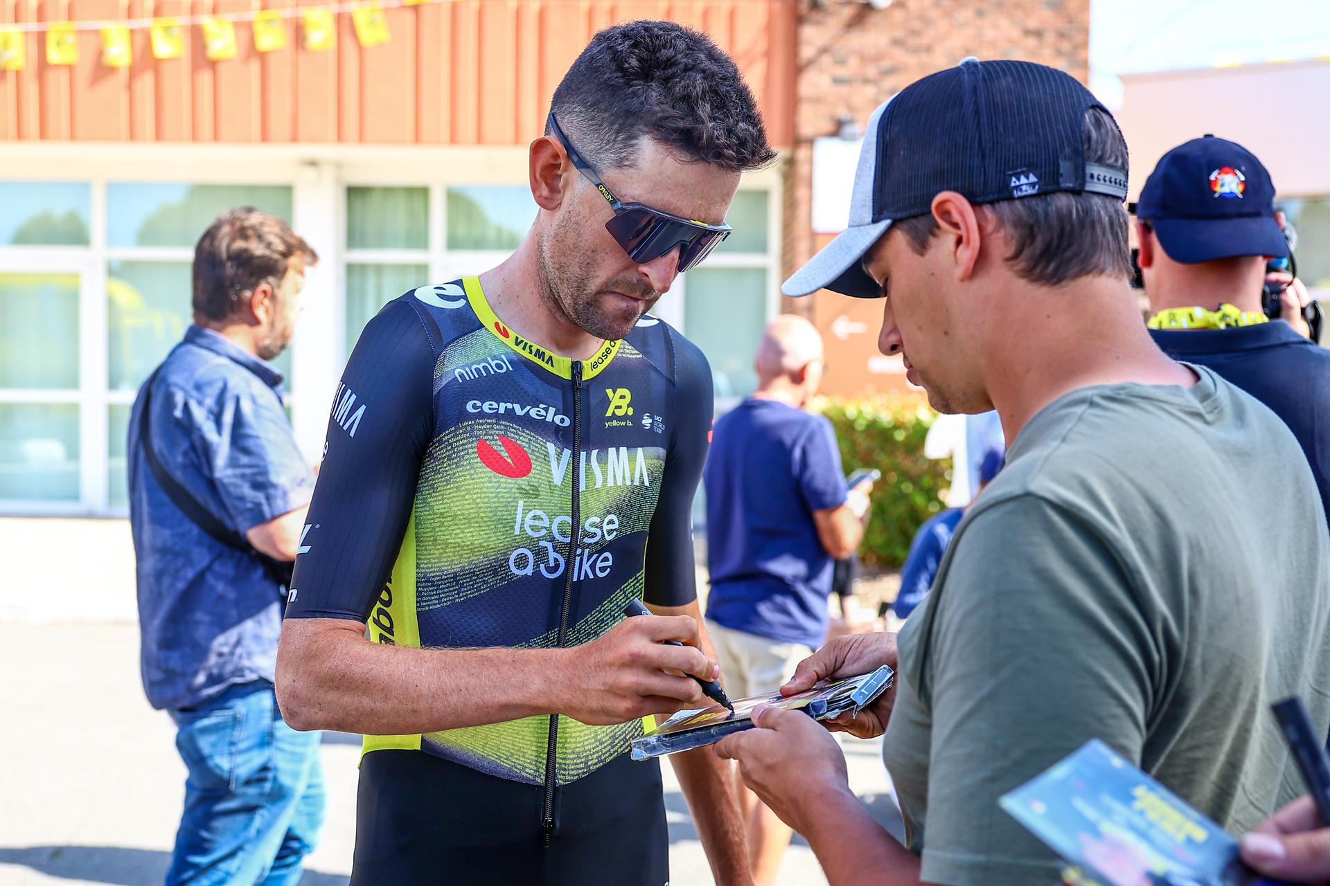 Belgian Tiesj Benoot of Team Visma-Lease a Bike pictured with some fans after a press conference of team Visma - Lease a Bike ahead of the 2025 Tour de France cycling race, in Lille, France, on Friday 04 July 2025. The 112th edition of the Tour de France starts on Saturday 5 July in Lille, France, and will finish in Paris, France on the 27th of July. BELGA PHOTO DAVID PINTENS