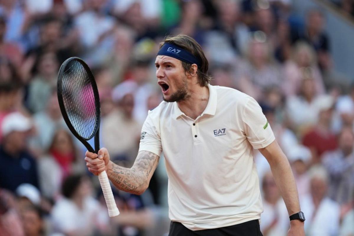 Kazakhstan's Alexander Bublik reacts after a point during his men's singles match against Britain's Jack Draper on day 9 of the French Open tennis tournament on Court Suzanne-Lenglen at the Roland-Garros Complex in Paris on June 2, 2025.  Dimitar DILKOFF / AFP