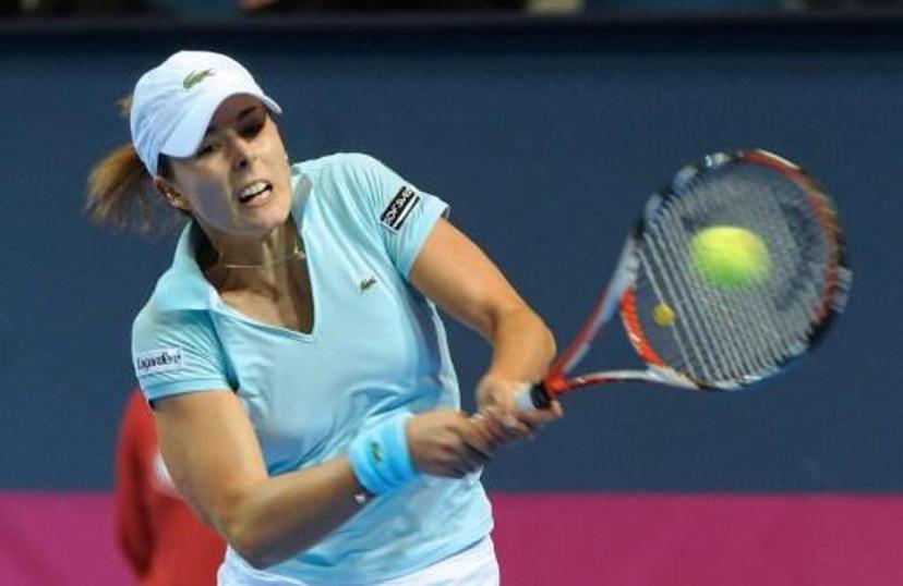French tennis player Alizée Cornet hits the ball during her match versus Italian Francesca Schiavonne during the first round of the 2009 Fed Cup World group France vs. Italy, on February 7, 2009, in Orleans, central France.  AFP PHOTO / ALAIN JOCARD