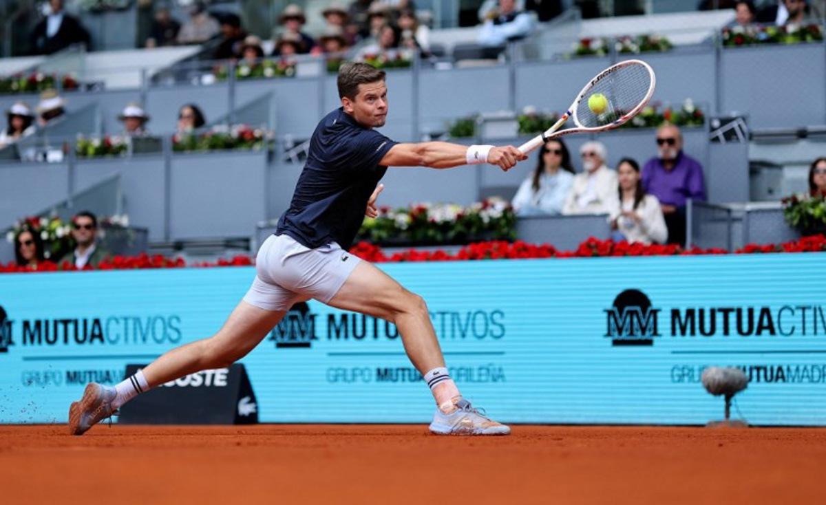 Belgium's Alexander Blockx returns the ball to Norway's Casper Ruud during their 2026 ATP Tour Madrid Open tennis tournament quarter-final singles match at the Caja Magica in Madrid, on April 30, 2026.  Thomas COEX / AFP