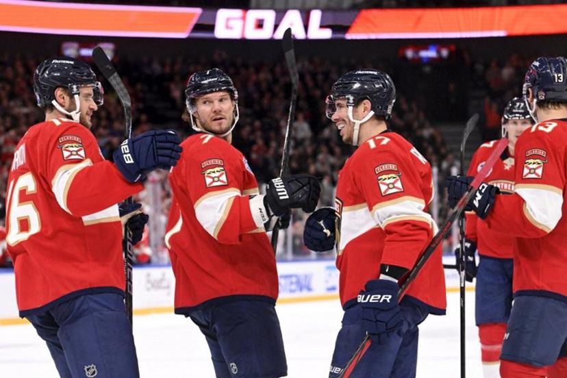 (L to R) Aleksander Barkov, Dmitry Kulikov, Evan Rodrigues, Sam Reinhart (13, R) and Niko Mikkola (background, 77) of Florida celebrate the opening 0-1 goal by Rodrigues during the NHL Global Series Ice Hockey match Dallas Stars vs Florida Panthers in Tampere, Finland on November 2, 2024.  Heikki Saukkomaa / Lehtikuva / AFP