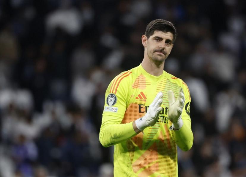 Real Madrid's Belgian goalkeeper #01 Thibaut Courtois applauds at the end of the UEFA Champions League quarter final second leg football match between Real Madrid CF and Arsenal at Santiago Bernabeu Stadium in Madrid on April 16, 2025.  Pierre-Philippe MARCOU / AFP