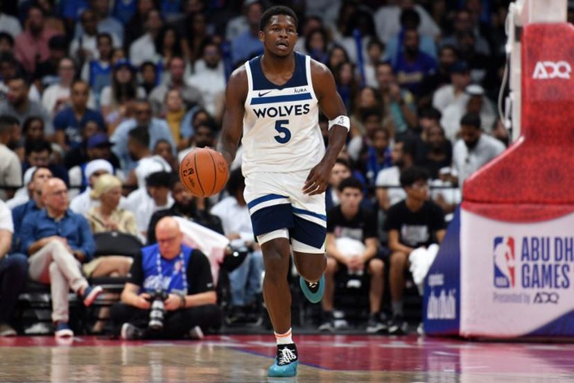 Minnesota Timberwolves' guard Anthony Edwards #5 dribbles the ball during the NBA Preseason game between the Dallas Mavericks and the Minnesota Timberwolves at the Etihad Arena in Abu Dhabi on October 7, 2023.  Ryan LIM / AFP