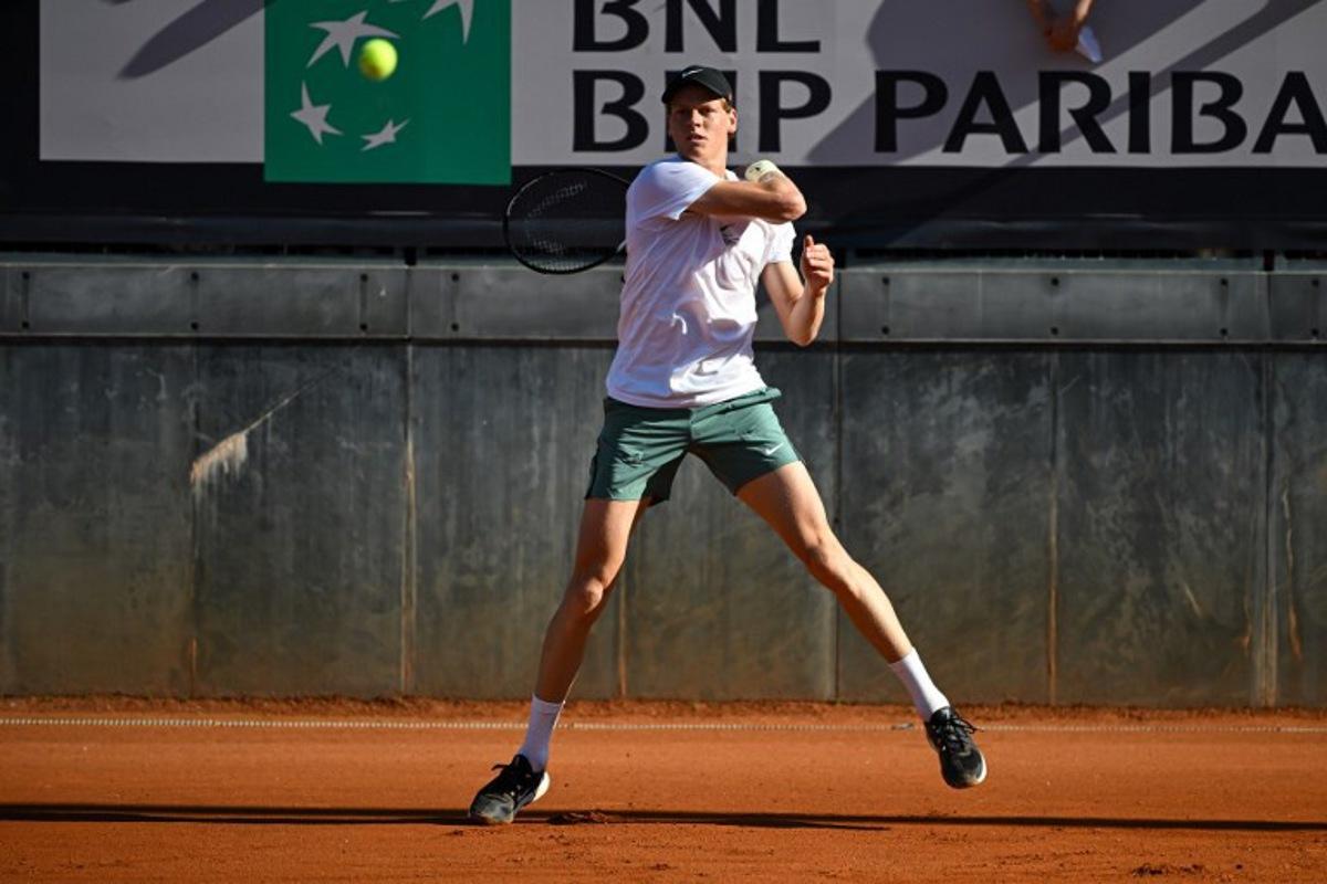 Italy's Jannik Sinner returns the ball to US Taylor Fritz during a training session ahead of the ATP Rome Open tennis tournament at Foro Italico in Rome, on May 7, 2025.  PIERO CRUCIATTI / AFP