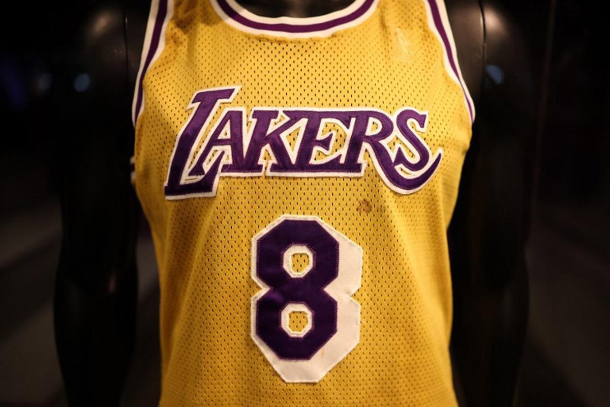 Kobe Bryant's Los Angeles Lakers game-worn jersey from his rookie debut game in November of 1996 is on display during a public exhibition at Sotheby's New York gallery on March 21, 2025.  CHARLY TRIBALLEAU / AFP