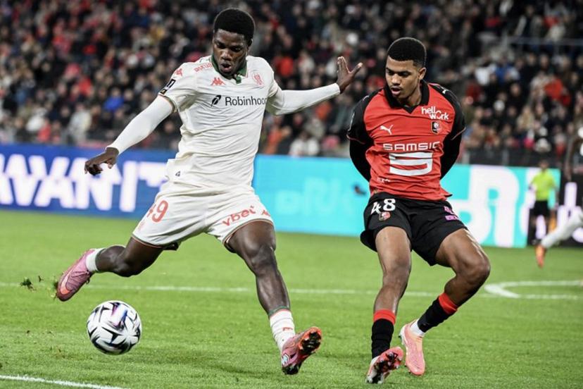 Nice's Cameroonian #47 Bernard Nguene (L) fights for the ball with Rennes' Moroccan defender #48 Ait Boudlal (R) during the French L1 football match between Stade Rennais FC and OGC Nice at the Roazhon Park stadium in Rennes, western France, on October 26, 2025.  Sebastien Salom-Gomis / AFP