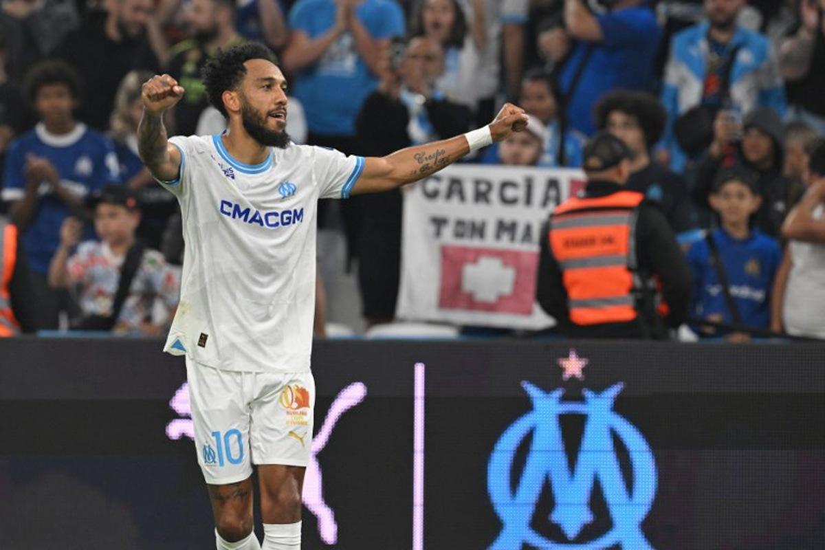 Marseille's French-Gabonese forward #10 Pierre-Emerick Aubameyang celebrates after scoring his team's first goal during the French L1 football match between Olympique Marseille (OM) and FC Lorient at the Stade Velodrome in Marseille, southern France, on May 12, 2024.  Nicolas TUCAT / AFP