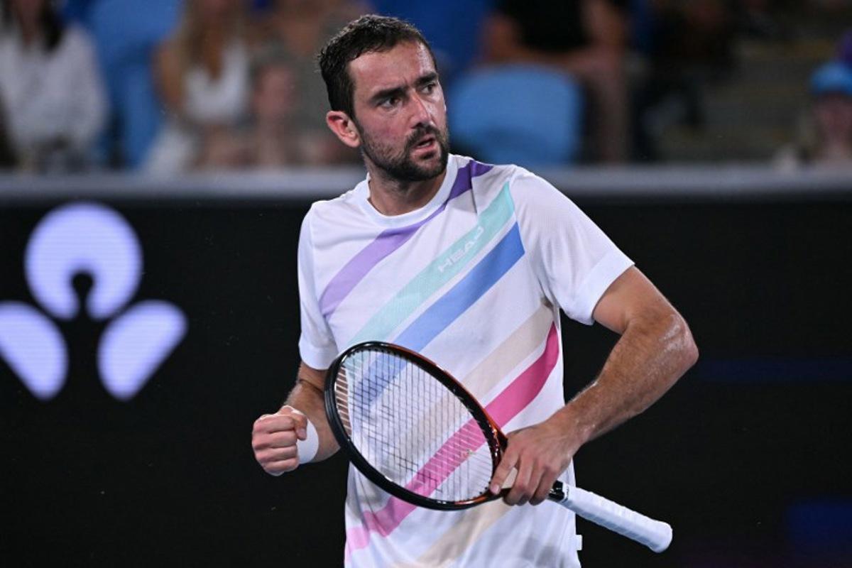 Croatia's Marin Cilic reacts after a point against Norway's Casper Ruud during their men's singles match on day seven of the Australian Open tennis tournament in Melbourne on January 24, 2026.  WILLIAM WEST / AFP