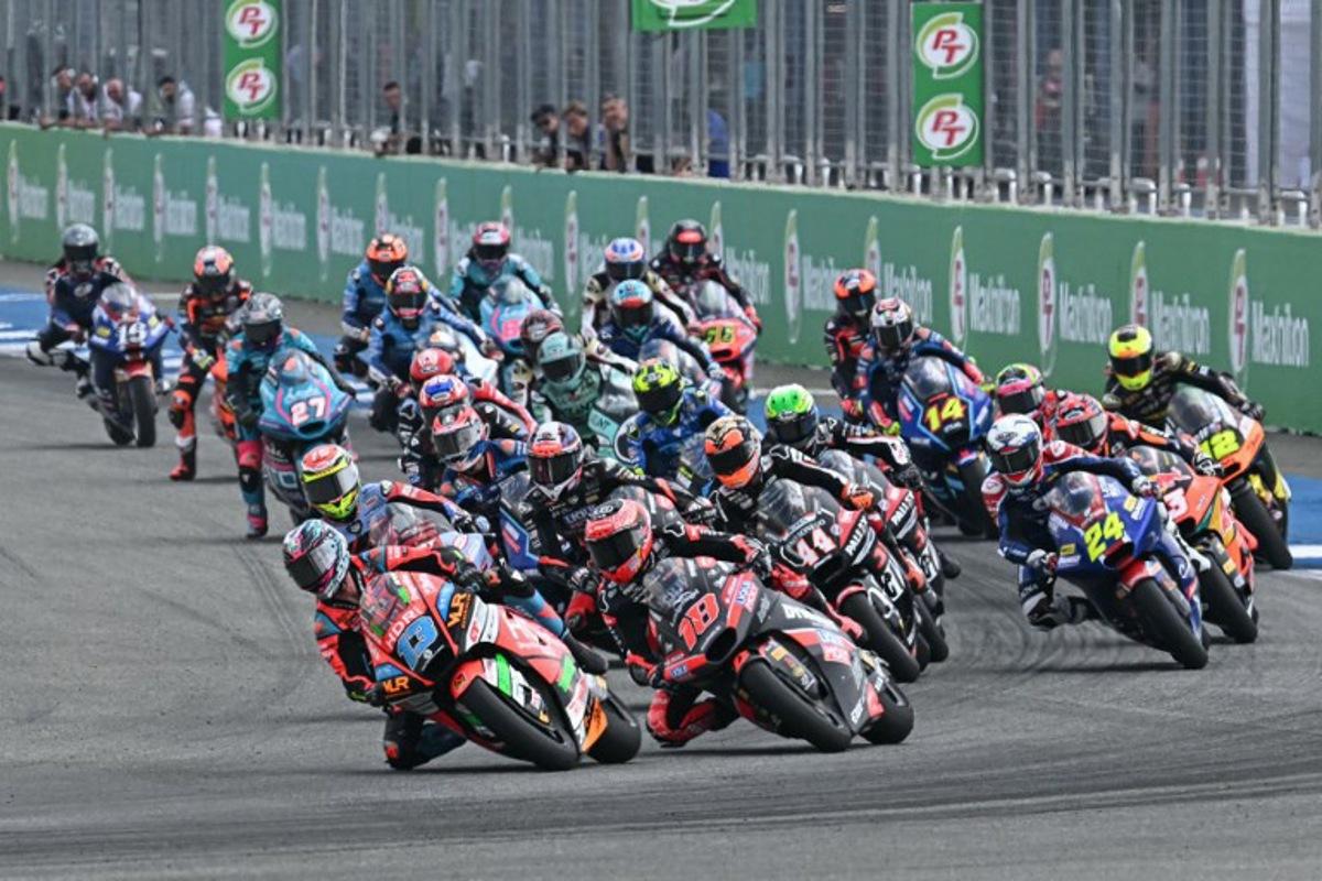Riders take the start of the Moto2 race at the MotoGP Thailand Grand Prix at the Buriram International Circuit in Buriram on March 2, 2025.  MOHD RASFAN / AFP