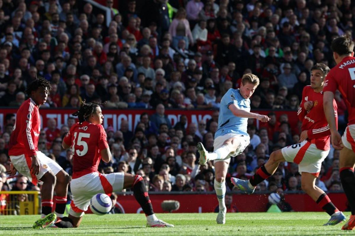 Manchester City's Belgian midfielder #17 Kevin De Bruyne shoots but fails to score during the English Premier League football match between Manchester United and Manchester City at Old Trafford in Manchester, north west England, on April 6, 2025. Darren Staples / AFP