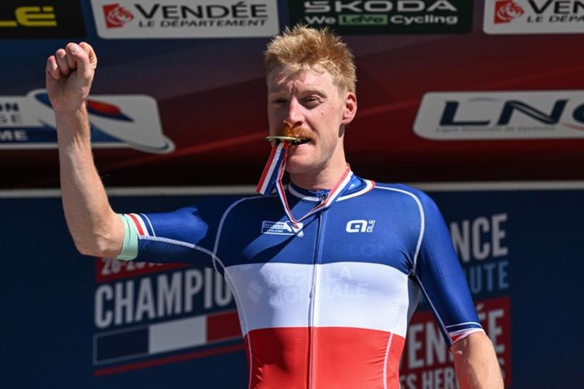 Decathlon-AG2R La Mondiale's French rider Dorian Godon poses with his medal after winning the men's Elite race of the French National Road Cycling championships, in Les Herbiers, western France, on June 29, 2025.  Sebastien Salom-Gomis / AFP