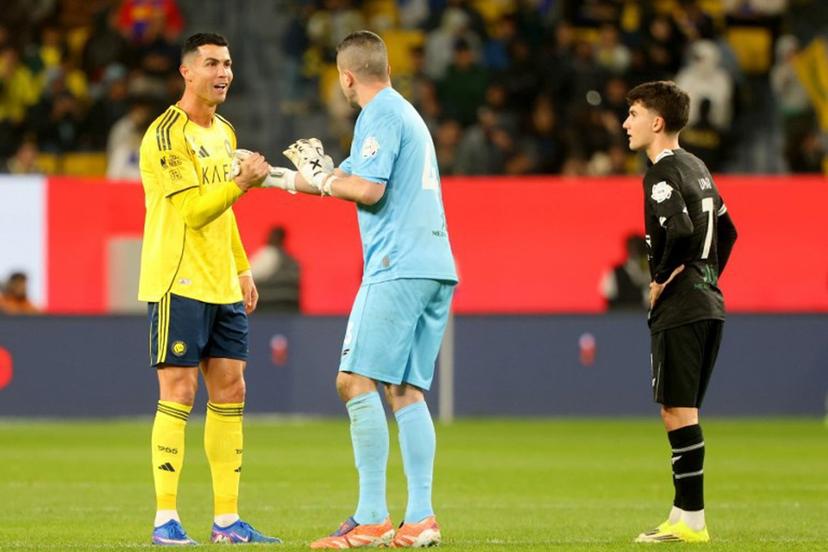 Nassr's Portuguese forward #07 Cristiano Ronaldo has words with al-Shabab's Brazilian goalkeeper #43 Marcelo Grohe during the Saudi Pro League football match between al-Nassr and al-Shabab at al-Awwal Park stadium, in Riyadh on January 17, 2026.  Fayez Nureldine / AFP