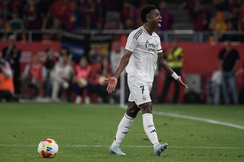 Real Madrid's Brazilian forward #07 Vinicius Junior reacts during the Spanish Cup, Copa del Rey (King's Cup) final football match between FC Barcelona and Real Madrid CF at La Cartuja stadium in Seville on April 26, 2025.  Josep LAGO / AFP