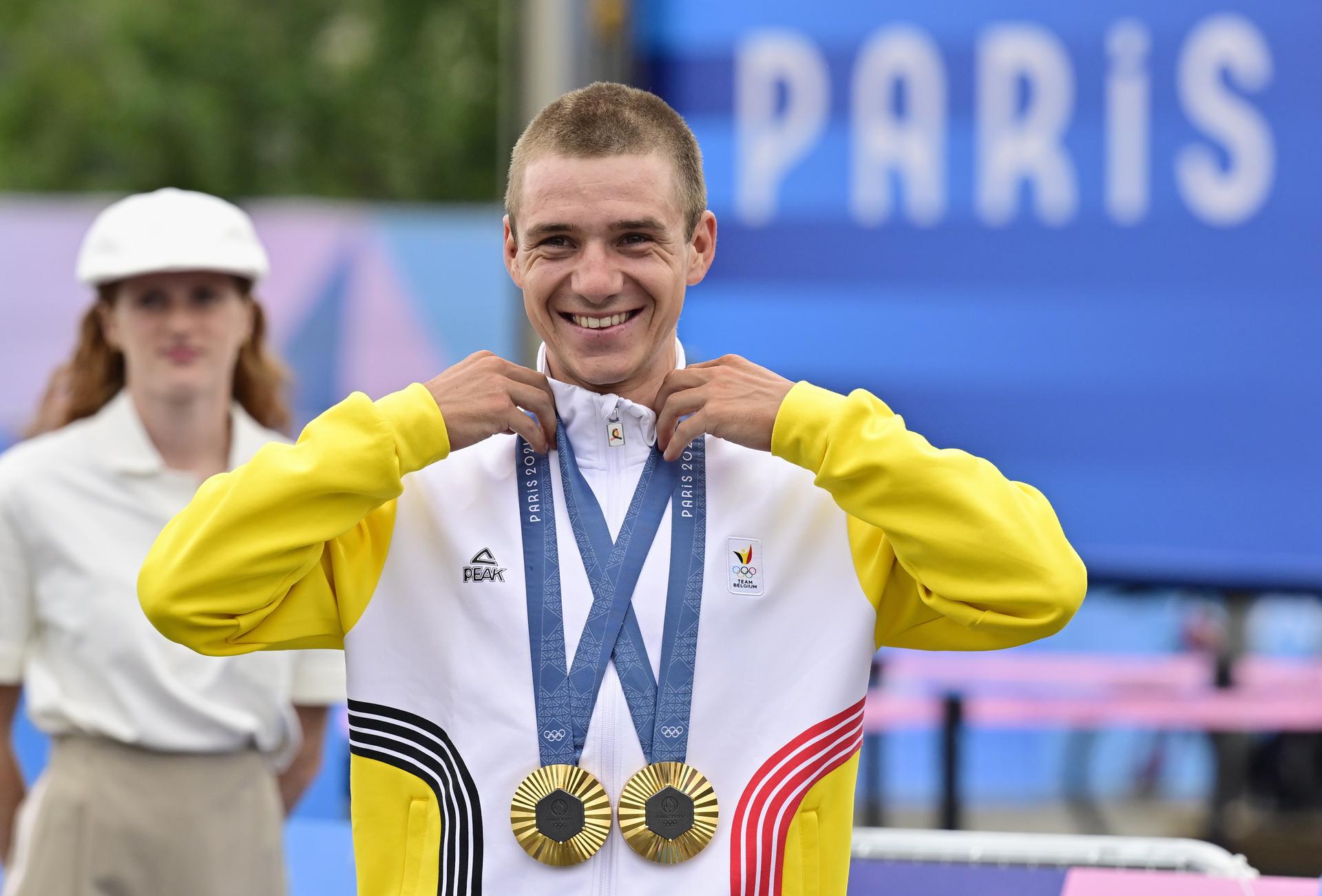 Two-time gold medal winner Belgian Remco Evenepoel celebrates with his medals during the podium ceremony after the men's road race at the Paris 2024 Olympic Games, on Saturday 03 August 2024 in Paris, France. The Games of the XXXIII Olympiad are taking place in Paris from 26 July to 11 August. The Belgian delegation counts 165 athletes competing in 21 sports. BELGA PHOTO DIRK WAEM