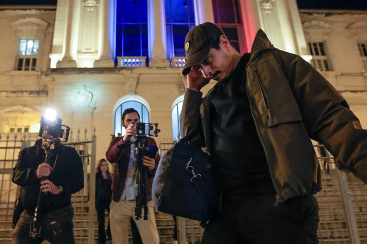 Former French L1 football player Wissam Ben Yedder (R) leaves the courthouse of Nice after his trial charged with sexually assaulting a woman in September, in Nice, southeastern France, on October 15, 2024.  The French football player Wissam Ben Yedder has been under strict police control awaiting trial but not in detention. The charges against him carry a maximum penalty of 10 years in jail.  Valery HACHE / AFP