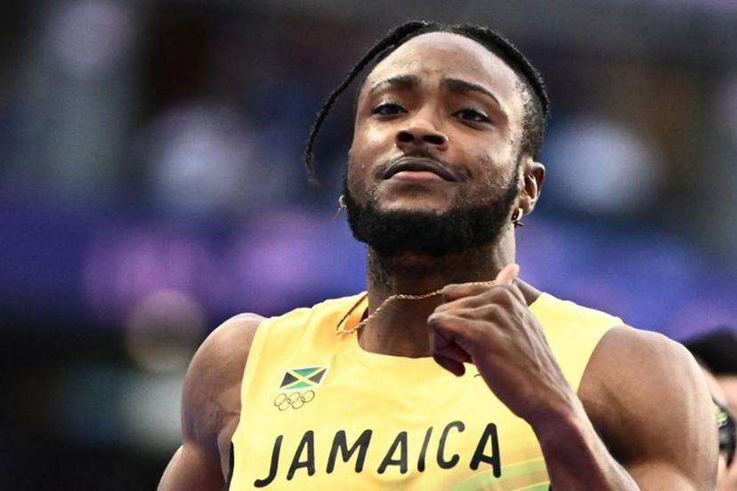 Jamaica's Kishane Thompson reacts after competing in the men's 100m semi-final of the athletics event at the Paris 2024 Olympic Games at Stade de France in Saint-Denis, north of Paris, on August 4, 2024.  Jewel SAMAD / AFP