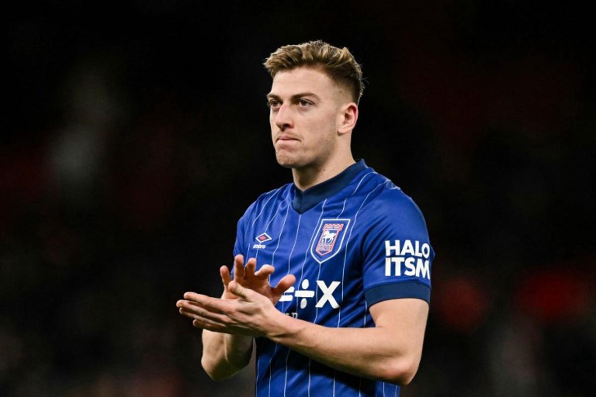 Ipswich Town's English midfielder #19 Liam Delap applauds at the end of the English Premier League football match between Manchester United and Ipswich Town at Old Trafford in Manchester, north west England, on February 26, 2025. Manchester United wins 3 - 2 against Ipswich Town. Oli SCARFF / AFP