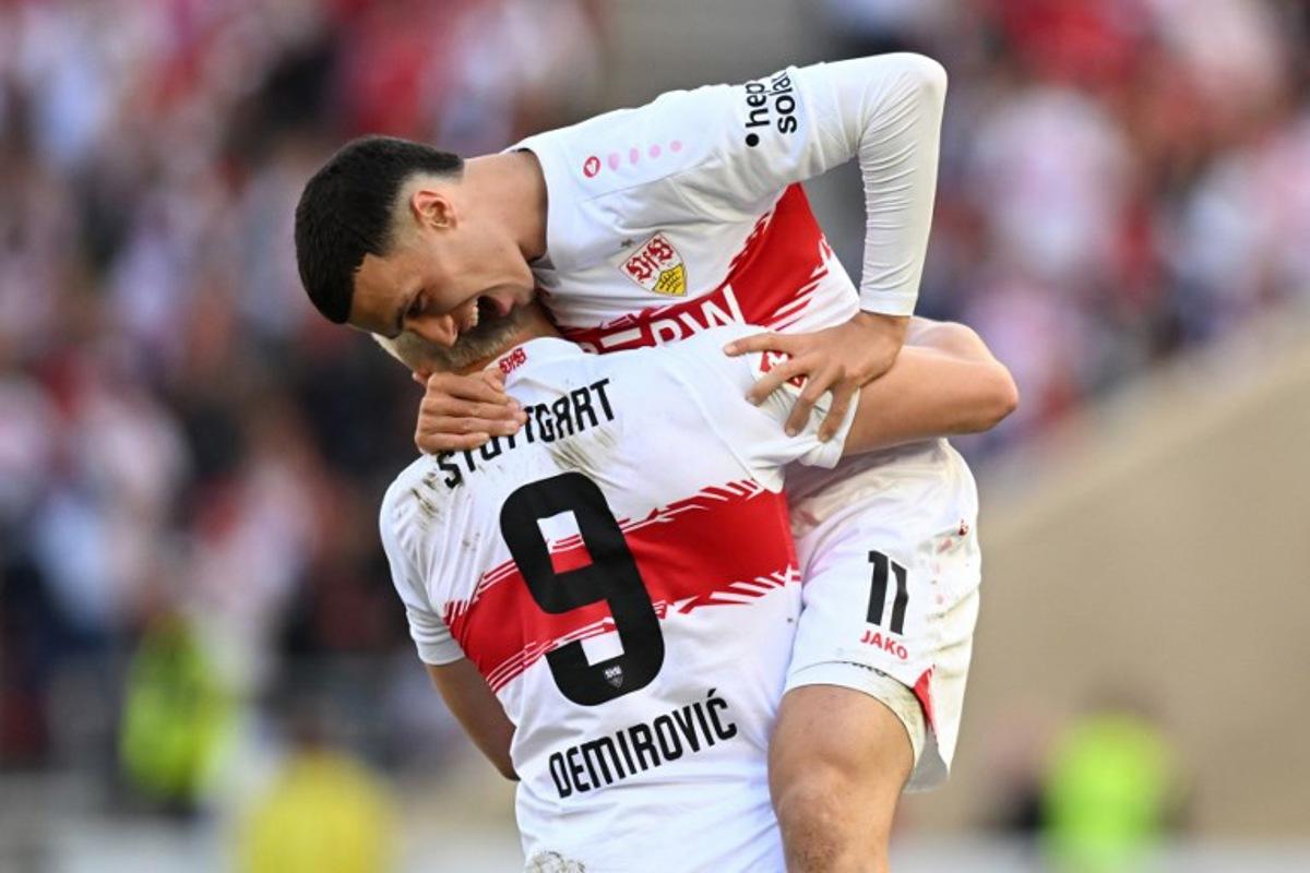 Stuttgart's Bosnian forward #09 Ermedin Demirovic celebrates scoring the equalising goal 1:1 with Stuttgart's German-Marrocan forward #11 Bilal El Khannouss during the German first division Bundesliga football match between VfB Stuttgart and SV Werder Bremen in Stuttgart, southwestern Germany on April 26, 2026.  THOMAS KIENZLE / AFP