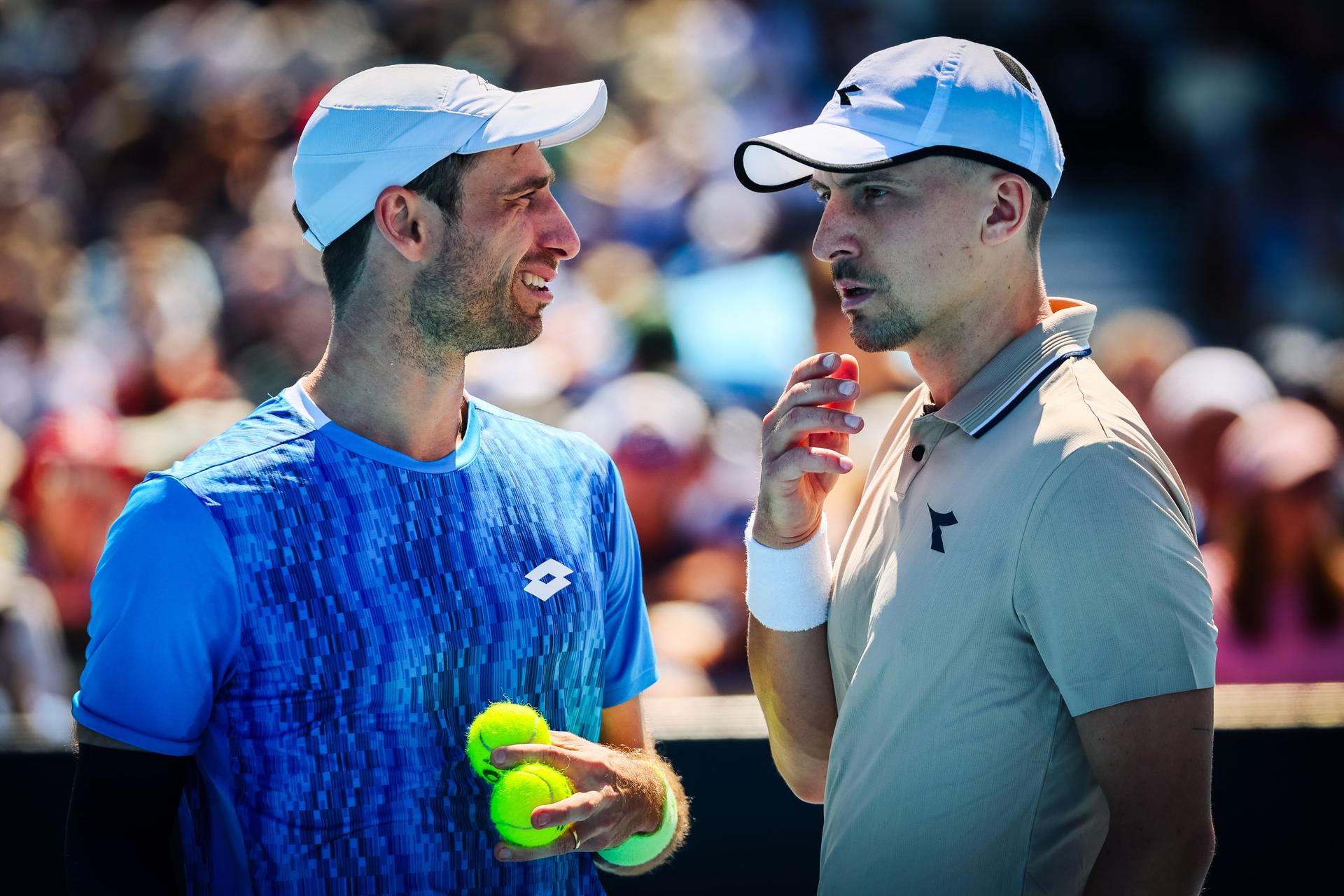 Belgian Sander Gille (blue) and Polish Jan Zielinski (beige) pictured during a doubles tennis match between Belgian-Polish pair Gille-Zielinski and Spanish-Chinese pair Carballes Baena-Yunchaokete, in the first round of the men's doubles at the 'Australian Open' Grand Slam tennis tournament, Thursday 16 January 2025 in Melbourne Park, Melbourne, Australia. The 2025 edition of the Australian Grand Slam takes place from January 12th to January 26th. Belgian-Polish pair won 6-1, 6-2. BELGA PHOTO PATRICK HAMILTON BELGIUM ONLY