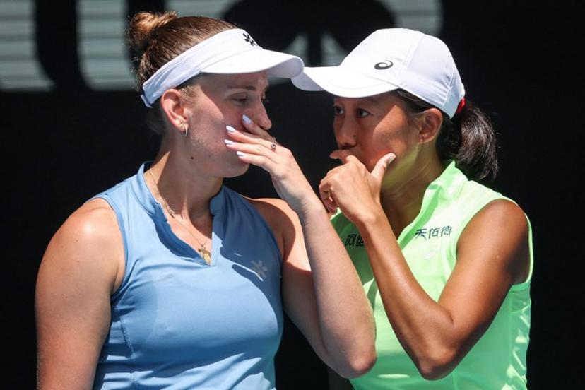 Belgium's Elise Mertens (L) talks to partner China's Zhang Shuai during their women's doubles final match against Kazakhstan's Anna Danilina and Serbia's Aleksandra Krunic on day fourteen of the Australian Open tennis tournament in Melbourne on January 31, 2026.  DAVID GRAY / AFP