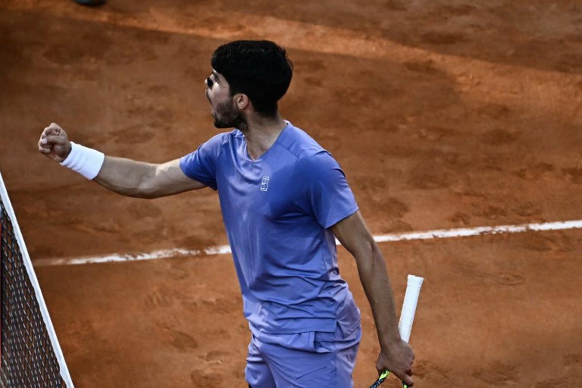 Spain's Carlos Alcaraz reacts during his men's singles final match against Italy's Jannik Sinner for the ATP Rome Open tennis tournament at Foro Italico in Rome on May 18, 2025.   Filippo MONTEFORTE / AFP