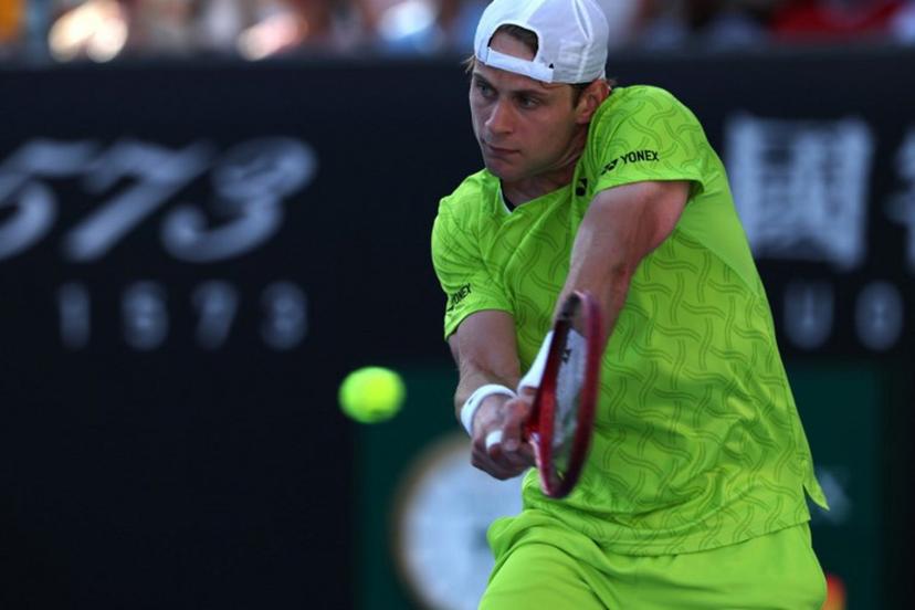 Belgium's Zizou Bergs hits a shot against Poland's Hubert Hurkacz during their men's singles match on day three of the Australian Open tennis tournament in Melbourne on January 20, 2026.  IZHAR KHAN / AFP