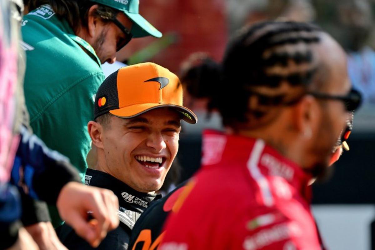 Aston Martin's Spanish driver Fernando Alonso (top) McLaren's British driver Lando Norris (C) and Ferrari's British driver Lewis Hamilton (R) chat ahead of the Abu Dhabi Formula One Grand Prix at the Yas Marina Circuit in Abu Dhabi on December 7, 2025.  Andrej ISAKOVIC / AFP