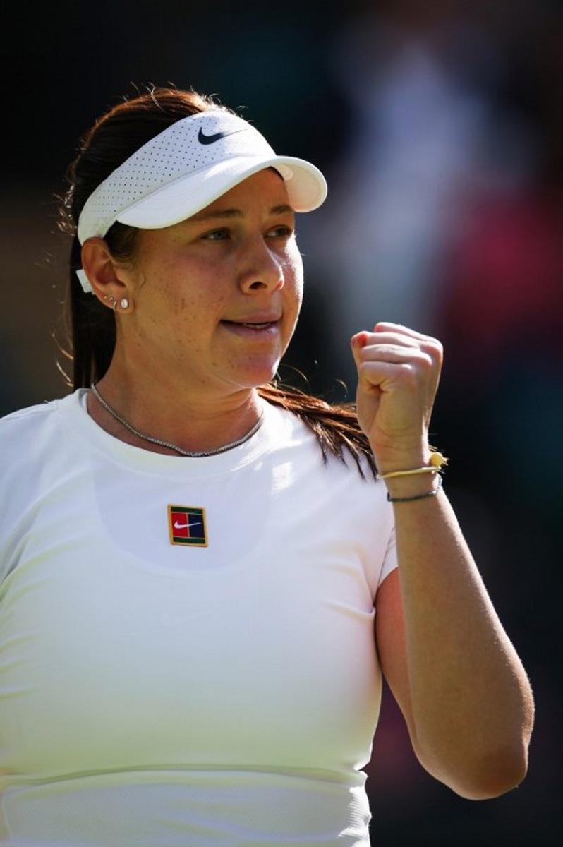 US player Amanda Anisimova celebrates winning the first set against Russia's Anastasia Pavlyuchenkova during their women's singles quarter-final tennis match on the ninth day of the 2025 Wimbledon Championships at The All England Lawn Tennis and Croquet Club in Wimbledon, southwest London, on July 8, 2025.  Adrian Dennis / AFP